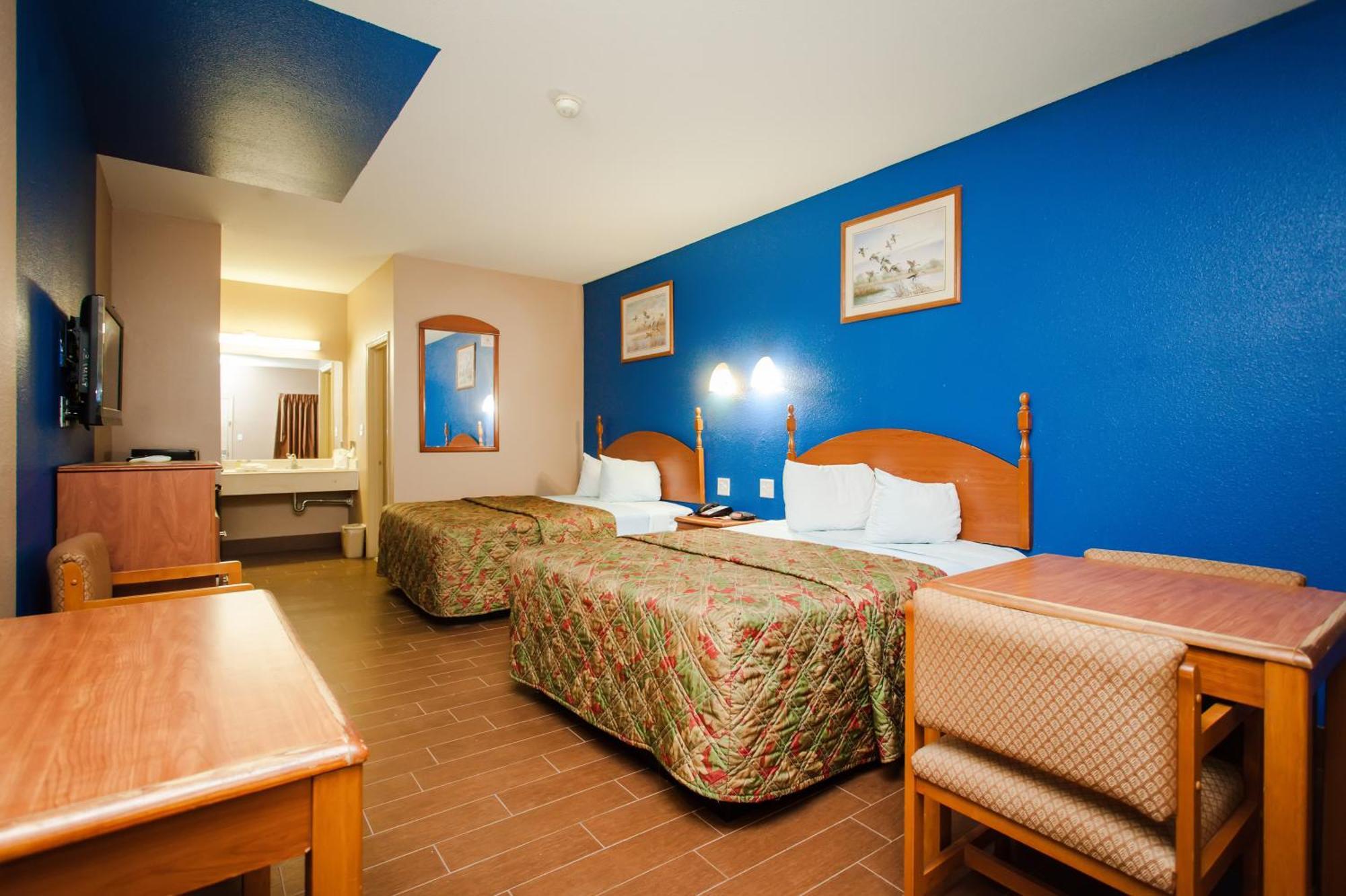 Scottish Inn & Suites Hankamer Bilik gambar